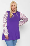 Floral Print, Contrasting Bubble Sleeves Tunic With A Round Neckline.